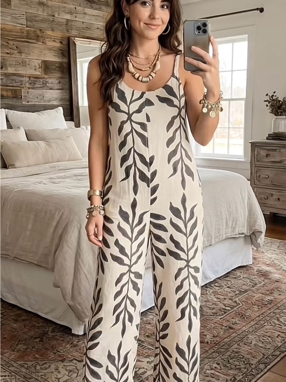 Sleeveless Cream Jumpsuit with Black Leaf Motif Size L